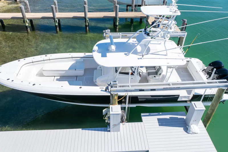 Slide: The Image of 2015 Intrepid 400 Center Console boat docked in clear water, aerial view. - 22