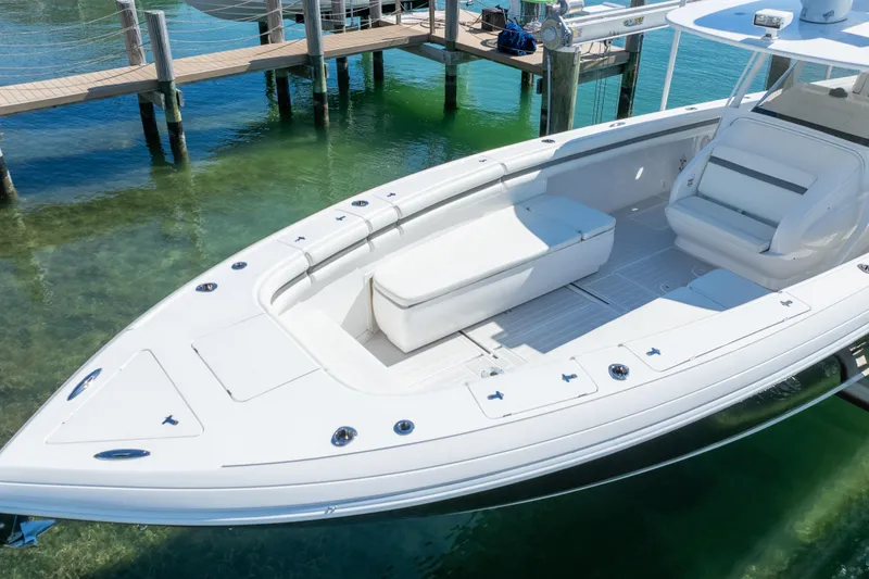 Slide: The Image of 2015 Intrepid 400 Center Console boat docked in clear water. - 24