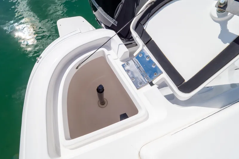 Slide: The Image of 2015 Intrepid 400 Center Console boat detail, featuring storage compartment and hinge. - 31