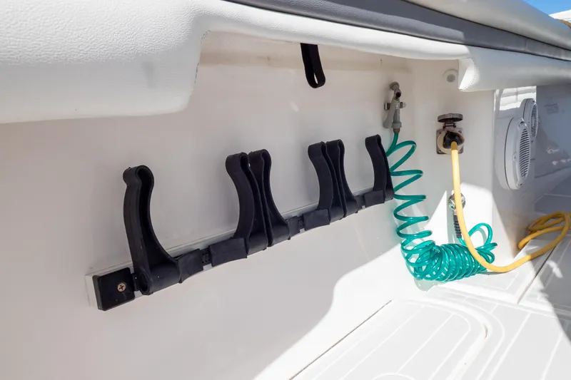 Slide: The Image of 2015 Intrepid 400 Center Console boat interior with hose and rod holders. - 43
