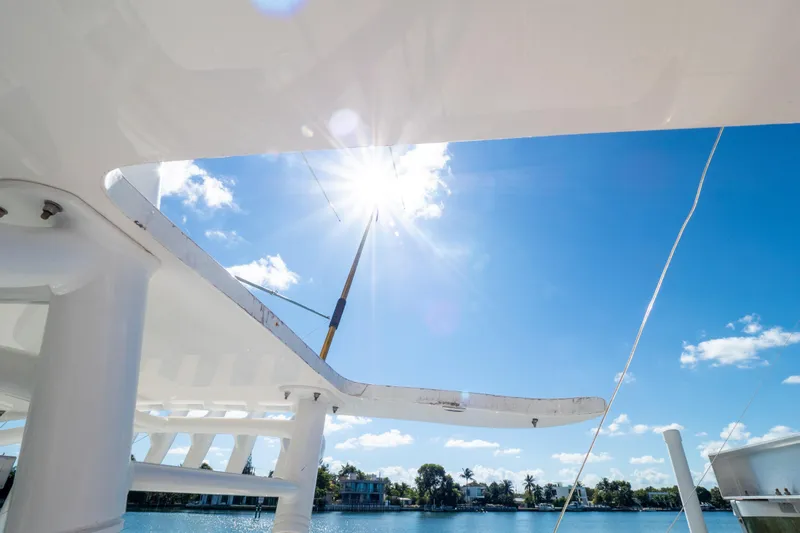 Slide: The Image of 2015 Intrepid 400 Center Console boat under bright sun and clear blue sky. - 44