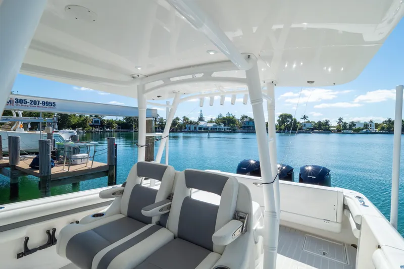 Slide: The Image of 2015 Intrepid 400 Center Console boat interior with waterfront view. - 52