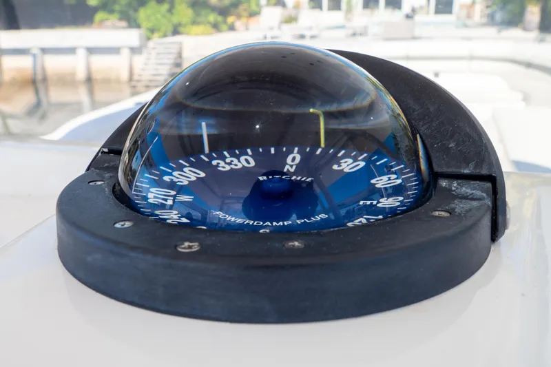 Slide: The Image of Compass on 2015 Intrepid 400 Center Console boat, displaying navigation directions. - 72
