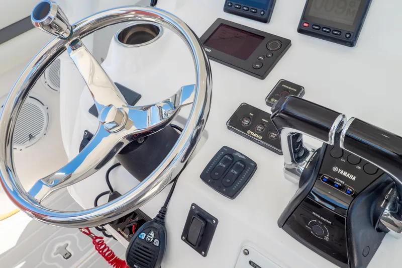 Slide: The Image of Control panel of 2015 Intrepid 400 Center Console with Yamaha throttle and steering wheel. - 78