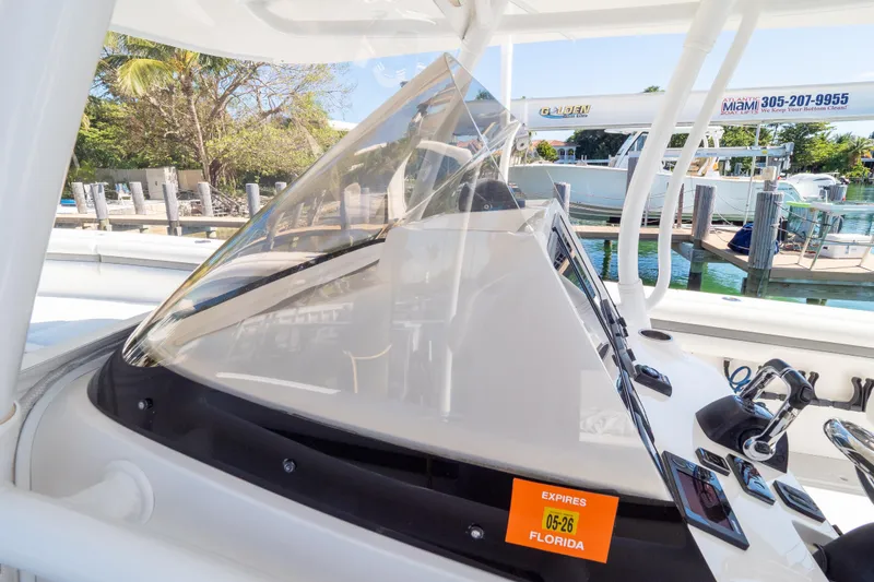 Slide: The Image of 2015 Intrepid 400 Center Console boat dashboard with Florida registration sticker. - 81