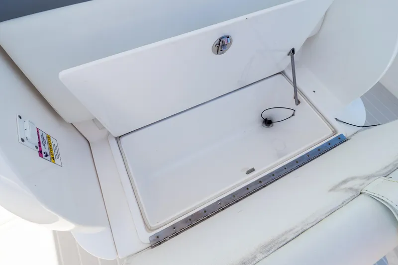 Slide: The Image of Open storage compartment on a 2015 Intrepid 400 Center Console boat. - 86