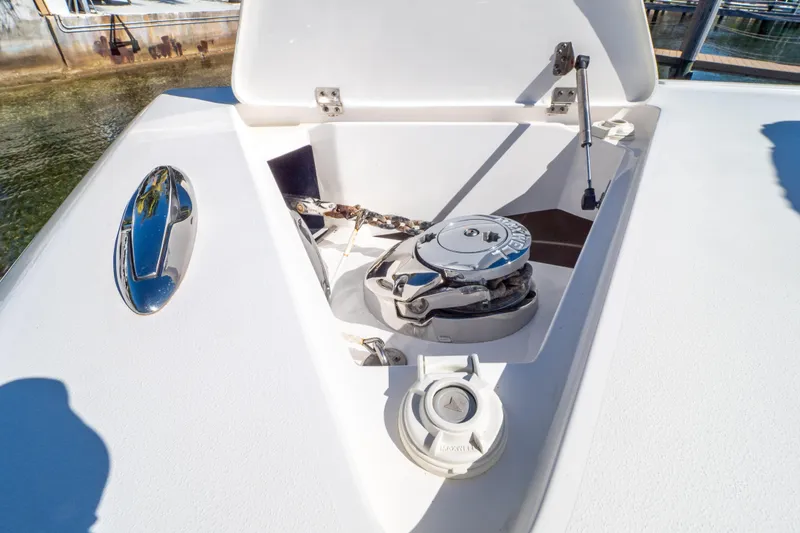 Slide: The Image of 2015 Intrepid 400 Center Console anchor compartment with winch and chain. - 94