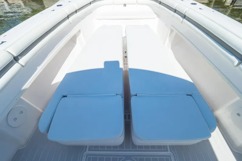 Slide: The Image of 2015 Intrepid 400 Center Console boat interior with cushioned seating. - 96