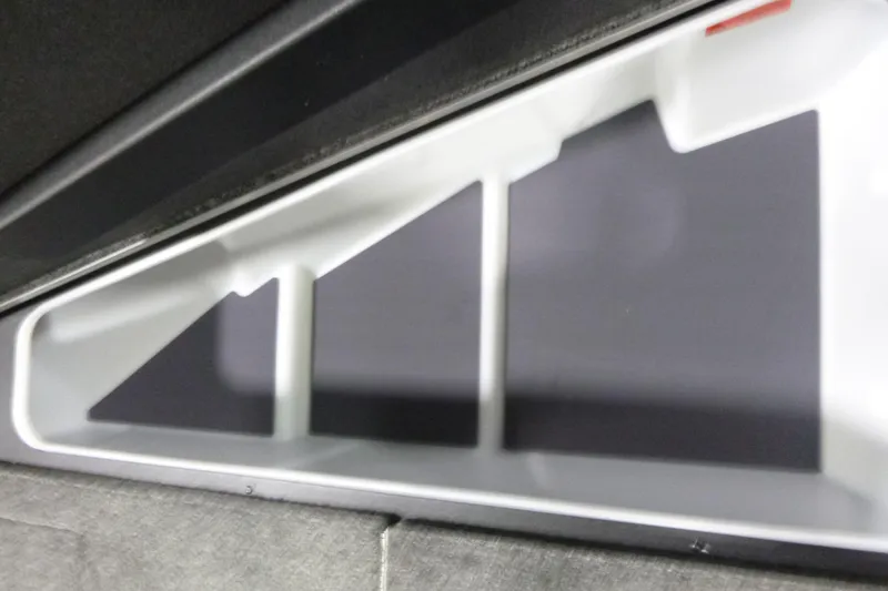 Slide: The Image of 2026 Alumacraft Competitor 205 Sport interior storage compartment detail. - 10