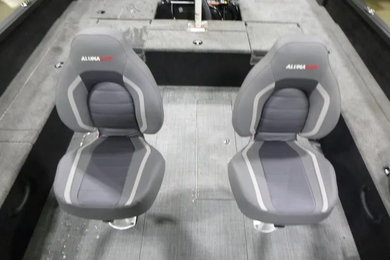 Slide: The Image of 2026 Alumacraft Competitor 205 Sport interior with two gray seats. - 15