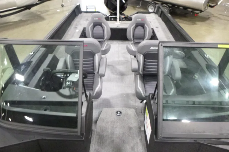 Slide: The Image of 2026 Alumacraft Competitor 205 Sport boat interior with four seats and windshield. - 6