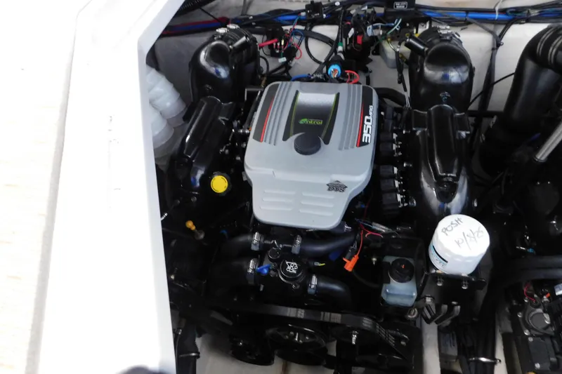 Slide: The Image of Engine compartment of 2017 Rinker EX 320 boat, featuring a 350 MAG engine. - 125