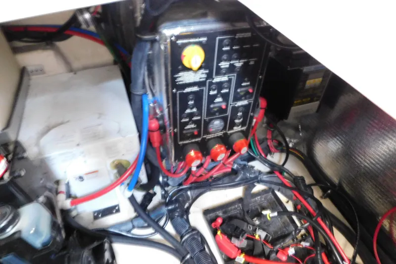 Slide: The Image of Electrical panel and wiring inside a 2017 Rinker EX 320 boat. - 127
