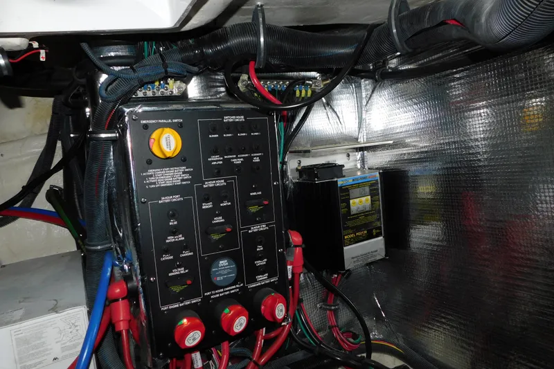 Slide: The Image of Electrical panel and wiring inside a 2017 Rinker EX 320 boat. - 128