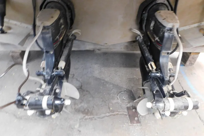 Slide: The Image of 2017 Rinker EX 320 boat outdrives on concrete floor. - 13