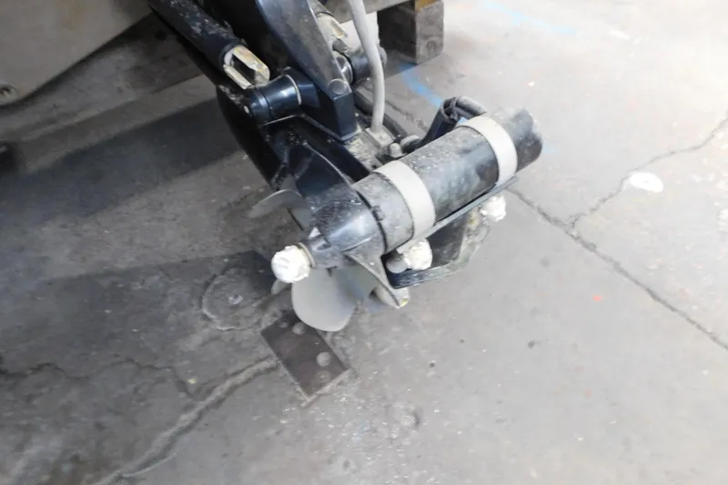 Slide: The Image of 2017 Rinker EX 320 boat propeller and drive system on concrete floor. - 16