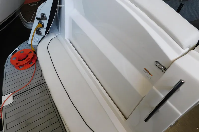 Slide: The Image of 2017 Rinker EX 320 boat interior with seating and deck details. - 20