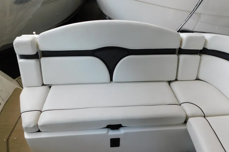 Slide: The Image of White seating on 2017 Rinker EX 320 boat, featuring sleek design and comfortable cushions. - 21
