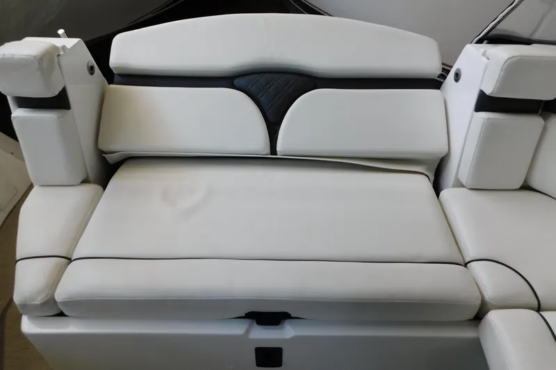 Slide: The Image of 2017 Rinker EX 320 boat interior with white cushioned seating. - 25