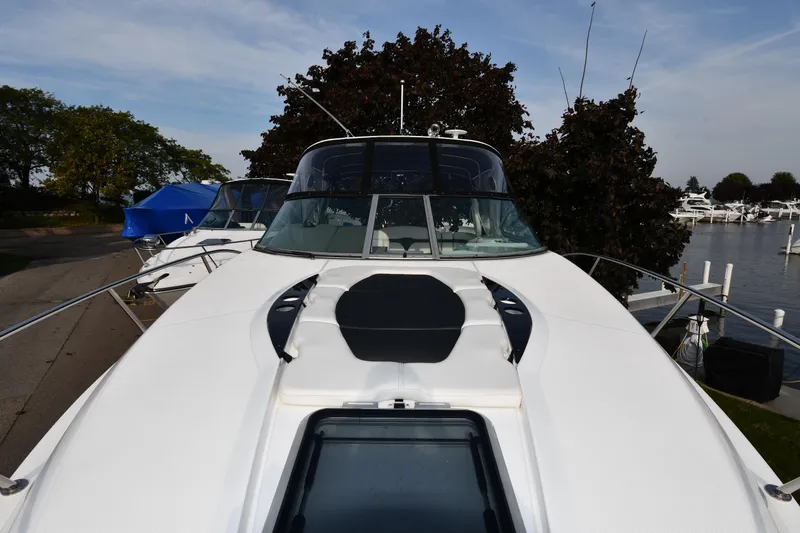 Slide: The Image of 2017 Rinker EX 320 boat docked, front view. - 3