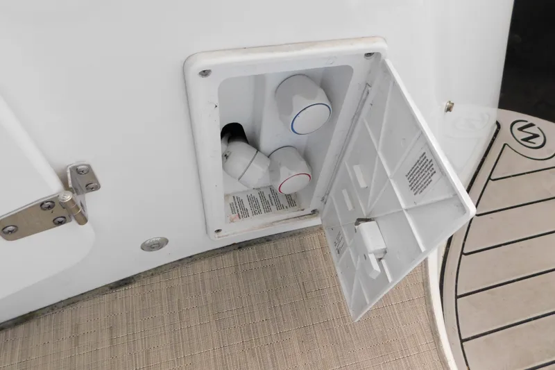 Slide: The Image of 2017 Rinker EX 320 boat shower controls with open access panel. - 33