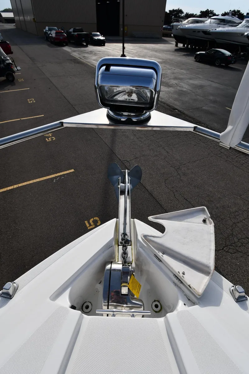 Slide: The Image of Bow view of a 2017 Rinker EX 320 yacht with anchor. - 4