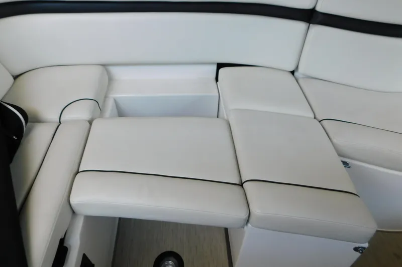Slide: The Image of 2017 Rinker EX 320 boat interior with white cushioned seating. - 51