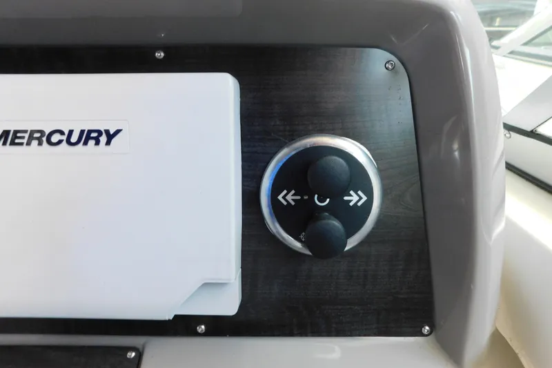 Slide: The Image of Control panel of 2017 Rinker EX 320 boat with Mercury branding. - 57