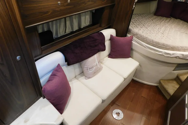 Slide: The Image of Interior of 2017 Rinker EX 320 boat with cozy seating and plush pillows. - 73