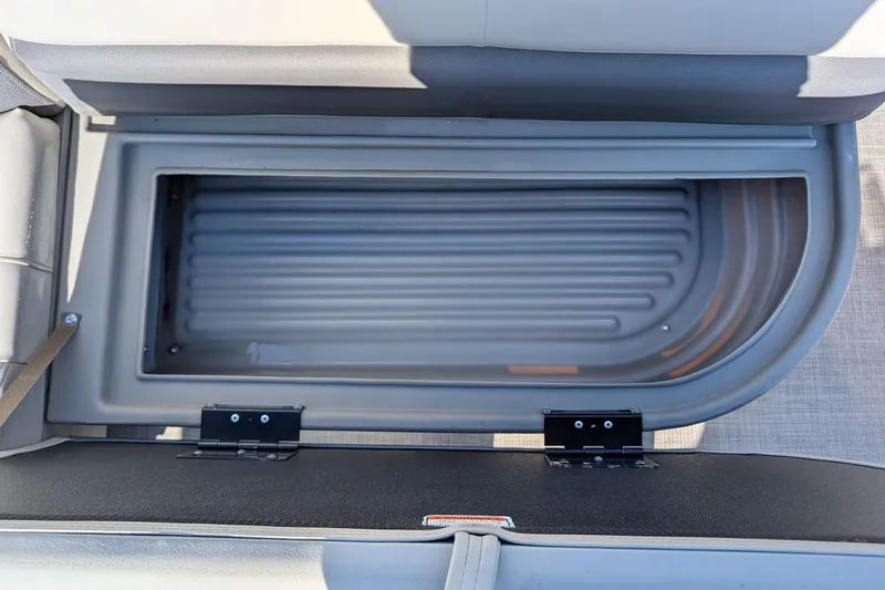Slide: The Image of Open storage compartment on 2025 Sun Tracker Party Barge 16 DLX pontoon boat. - 16