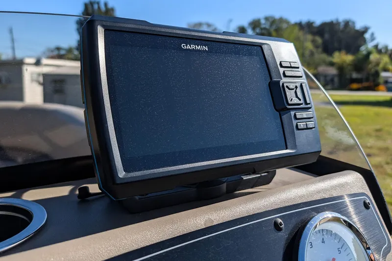 Slide: The Image of Garmin GPS on 2025 Sun Tracker Party Barge 16 DLX dashboard, sunny day. - 18