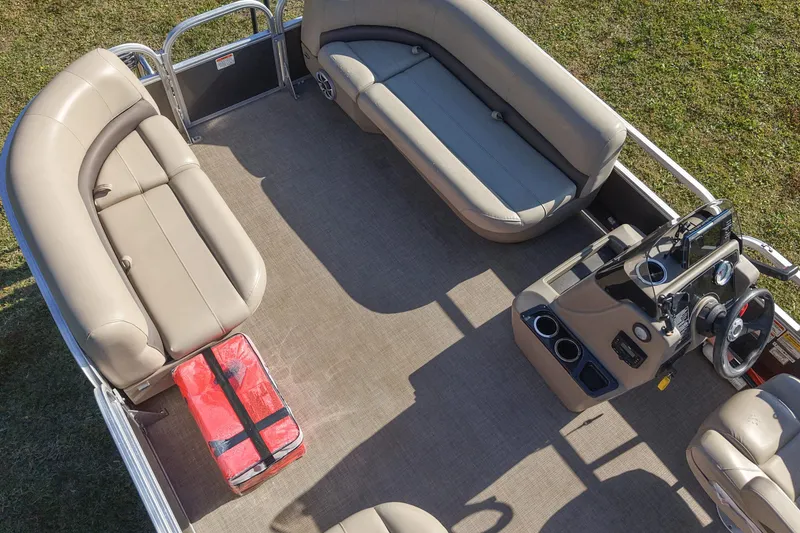 Slide: The Image of 2025 Sun Tracker Party Barge 16 DLX interior with seating and control console. - 6