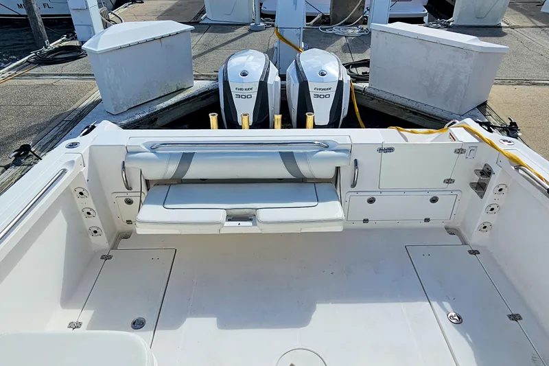 Slide: The Image of 2005 Wellcraft 290 Coastal boat with dual Evinrude 300 engines at dock. - 11