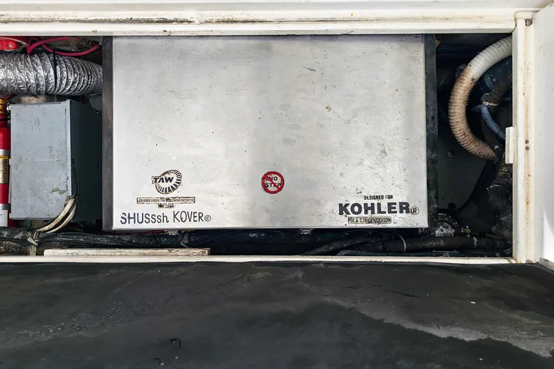 Slide: The Image of Engine compartment of 2005 Wellcraft 290 Coastal with Kohler generator and SHUSssh KOVER. - 24