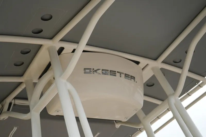 Slide: The Image of 2017 Skeeter SX230 boat canopy with logo, showcasing sturdy framework. - 11