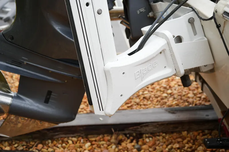 Slide: The Image of 2017 Skeeter SX230 boat motor mount detail on gravel surface. - 15