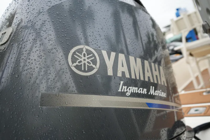 Slide: The Image of Close-up of Yamaha outboard motor on 2017 Skeeter SX230 boat, with water droplets. - 18