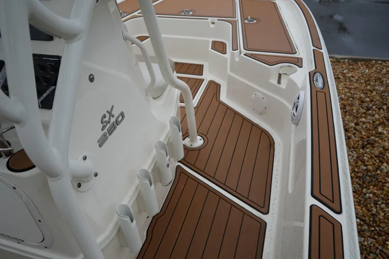 Slide: The Image of 2017 Skeeter SX230 boat deck with brown and white detailing. - 29