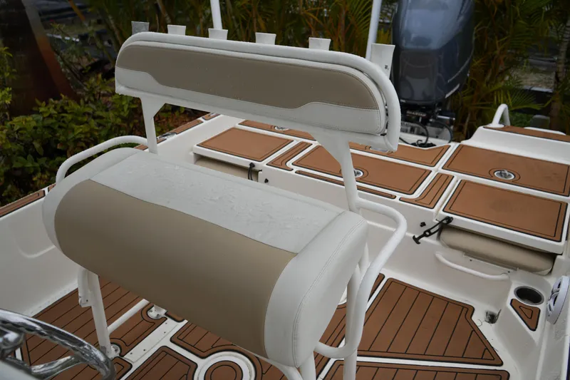 Slide: The Image of 2017 Skeeter SX230 boat interior with tan and white seating and deck. - 39