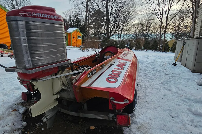 Slide: The Image of 1987 De Silva F Class Race boat with Mercury engine in snowy yard. - 20