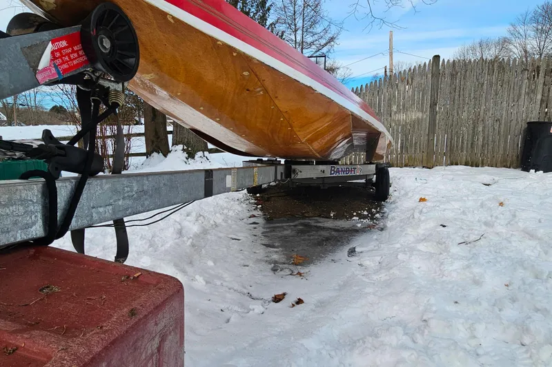 Slide: The Image of 1987 De Silva F Class Race boat on trailer in snowy yard. - 23