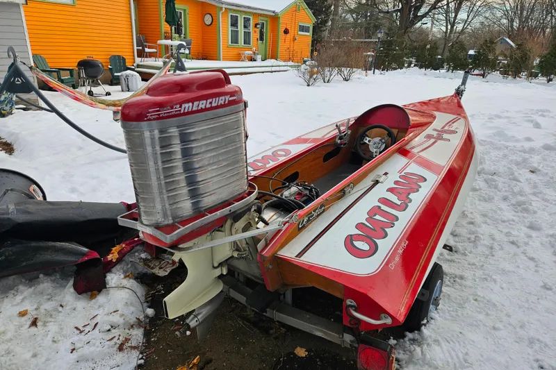 Slide: The Image of 1987 De Silva F Class Race boat with Mercury engine in snowy yard. - 3