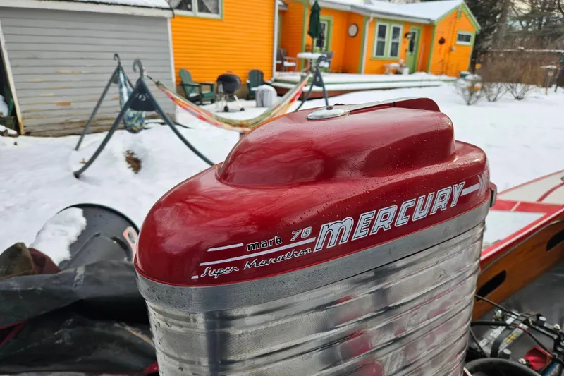Slide: The Image of Red Mercury outboard motor on 1987 De Silva F Class Race boat, snowy backyard setting. - 5