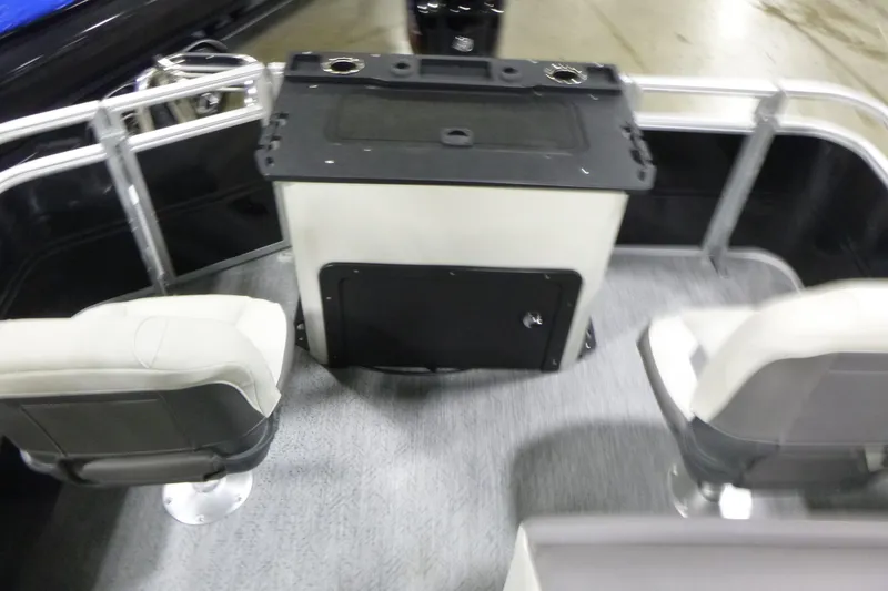 Slide: The Image of 2026 Sun Tracker Fishin' Barge 22 DLX interior with seating and storage area. - 15