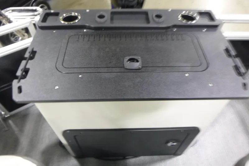 Slide: The Image of 2026 Sun Tracker Fishin' Barge 22 DLX fishing station with rod holders and storage. - 16