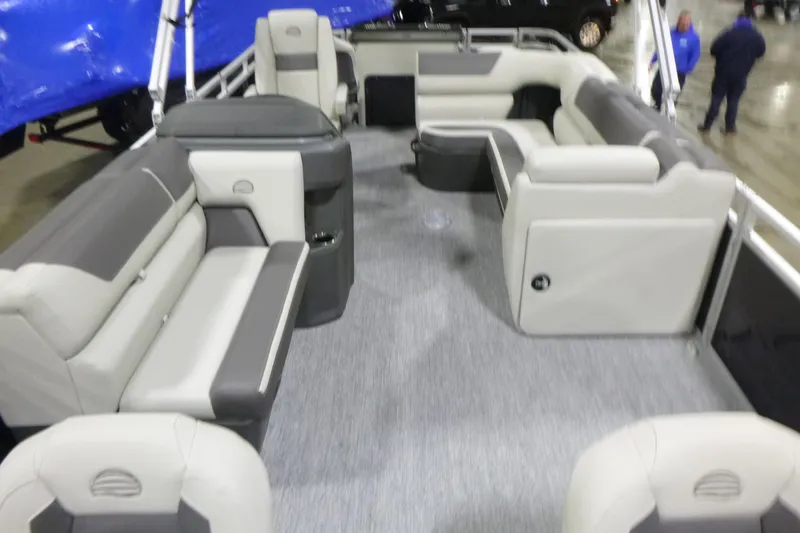 Slide: The Image of 2026 Sun Tracker Fishin' Barge 22 DLX interior with spacious seating and modern design. - 4
