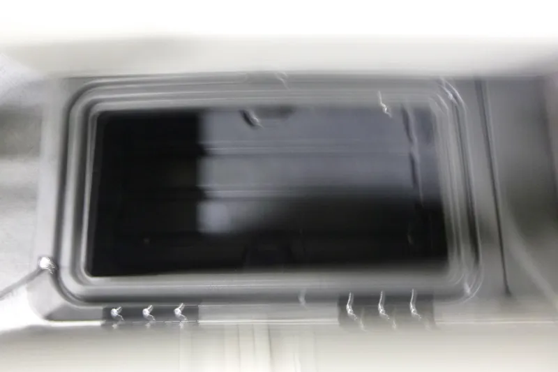 Slide: The Image of Storage compartment of 2026 Sun Tracker Fishin' Barge 22 DLX boat. - 9