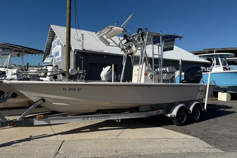 The Image of 2007 Pathfinder 2400 Tournament Edition boat on trailer at marina. - 1
