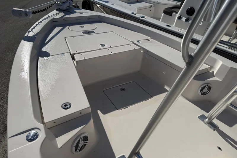Slide: The Image of 2007 Pathfinder 2400 Tournament Edition boat deck with storage compartments and speakers. - 8