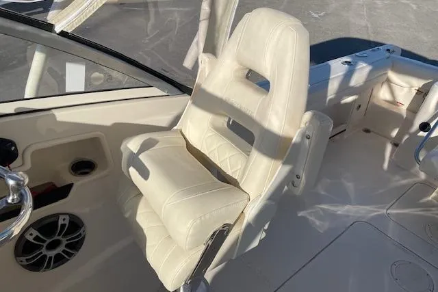 Slide: The Image of 2022 Grady-White Freedom 235 boat interior with white cushioned seating. - 14